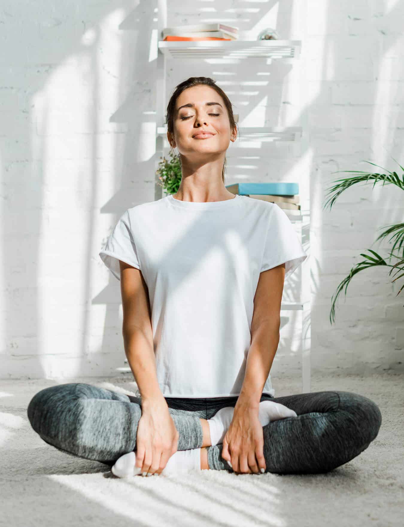 Woman sitting in yoga pose
